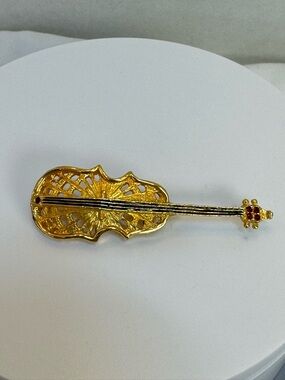 Gold-tone Violin Brooch with Red Accents